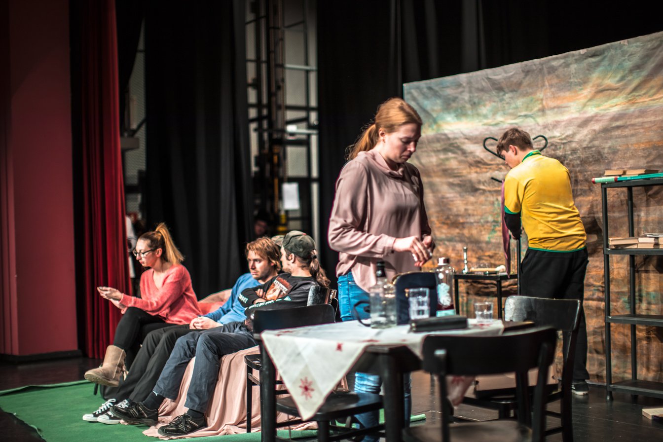 Theater Group Rehearsing A Play On Stage